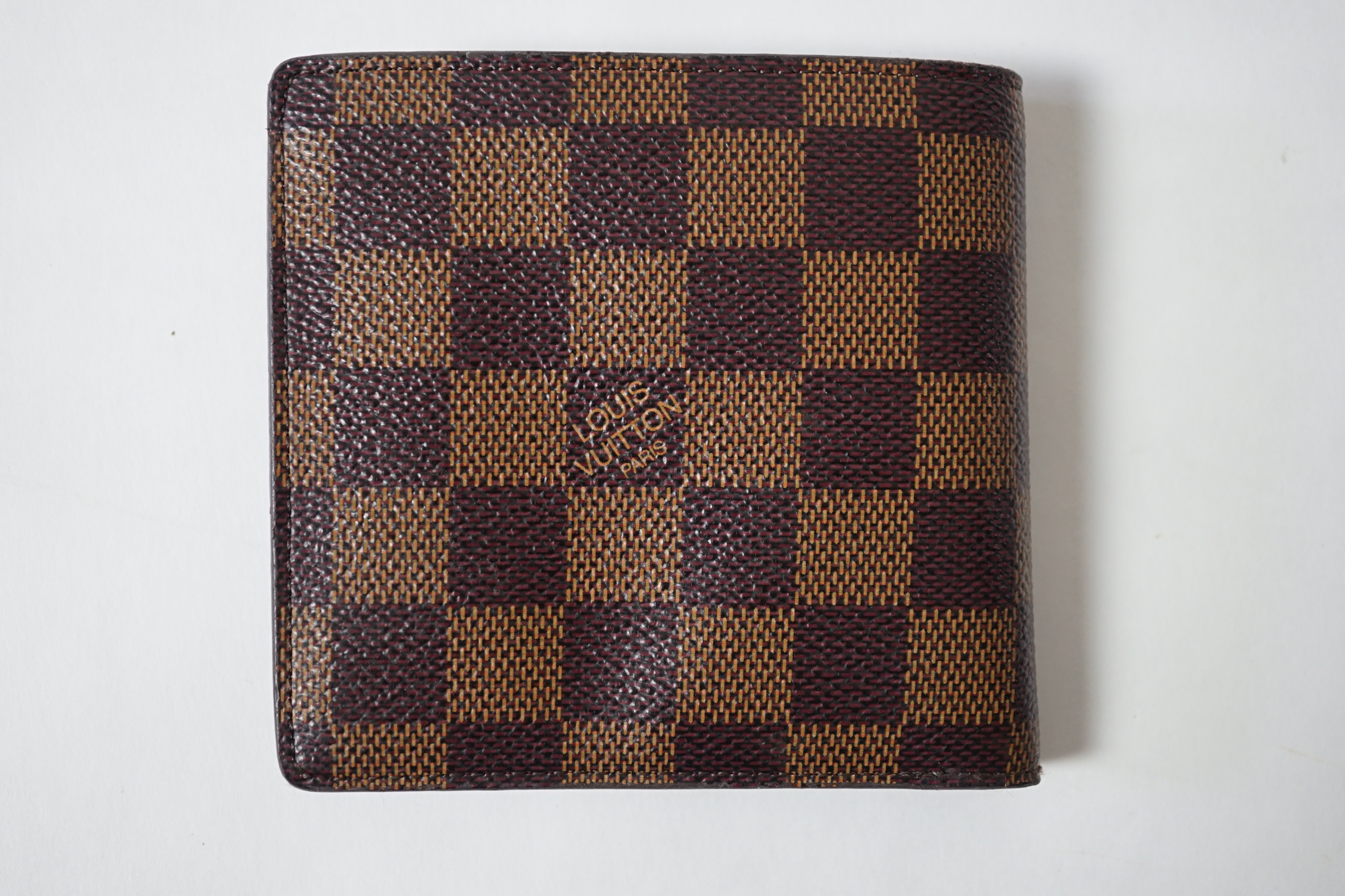 A Louis Vuitton bifold Damier coated canvas Marco wallet, height 10cm, width 11cm